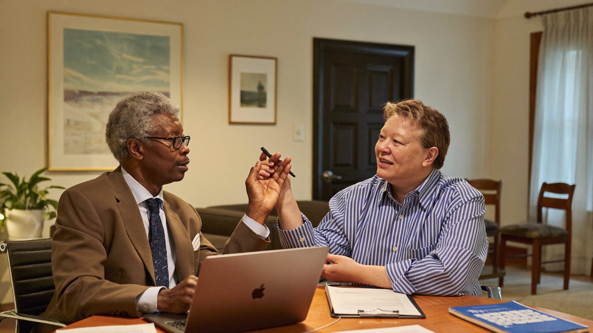 Advisor and client discussing retirement planning documents